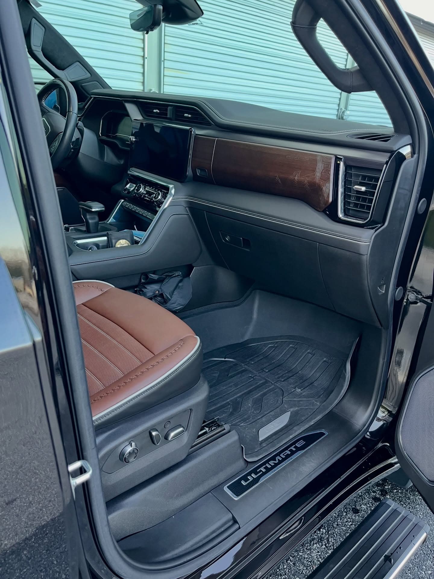 Spotless truck interior with clean leather seats and wood-trim dash, Cumming GA