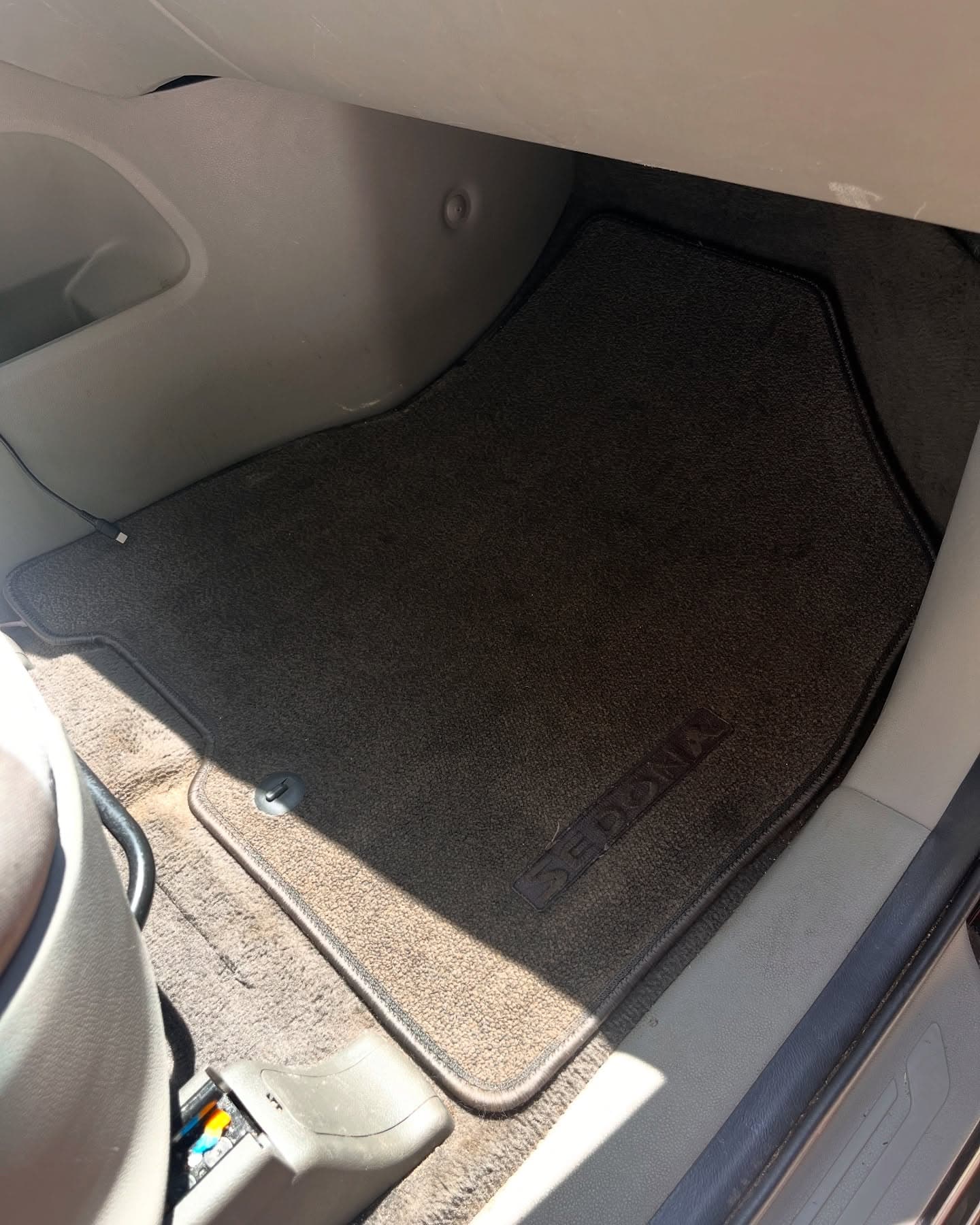 The same passenger footwell spotless after a full detail, Cumming GA