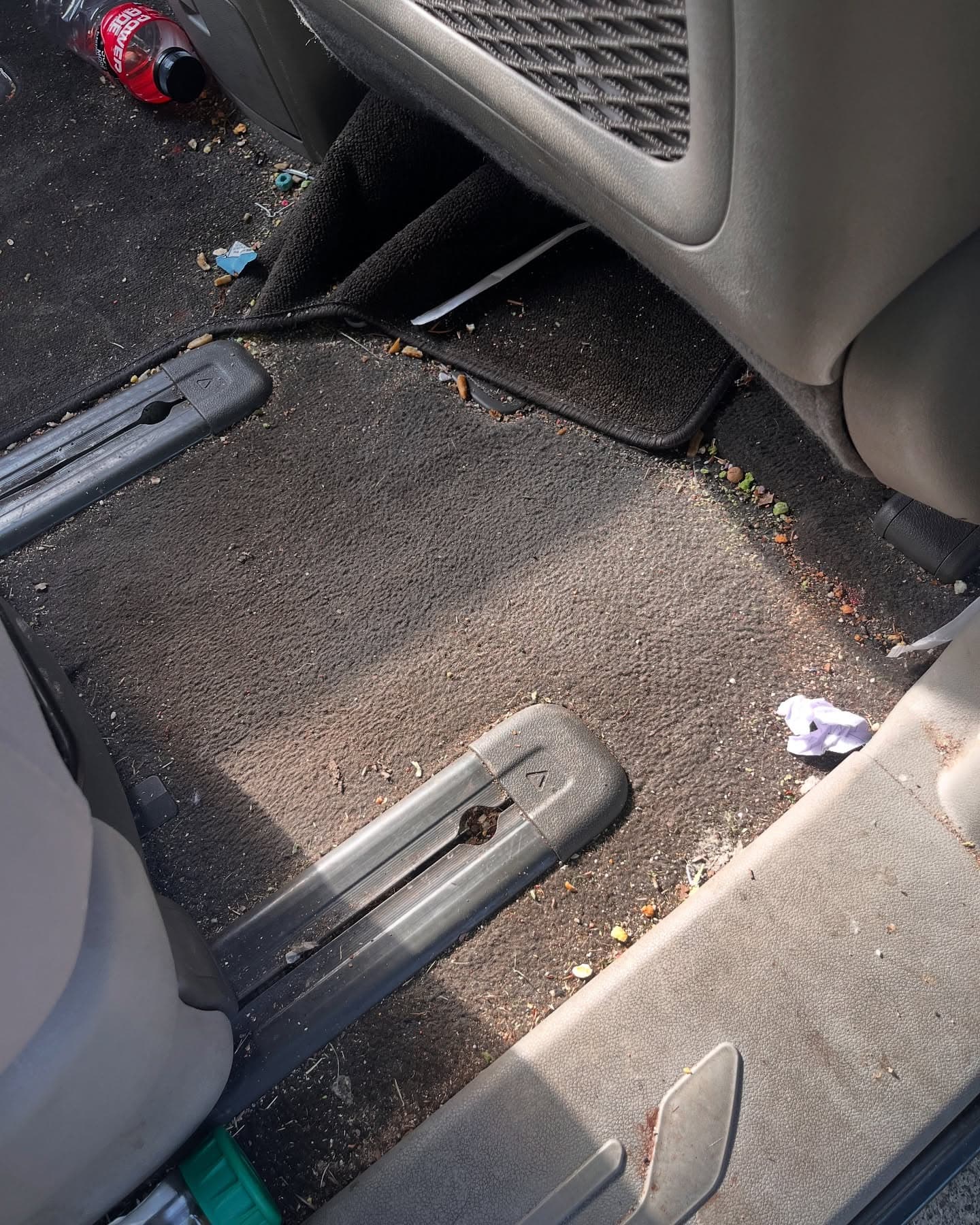 Before interior detail — trash and debris on the floor of a vehicle, Cumming GA