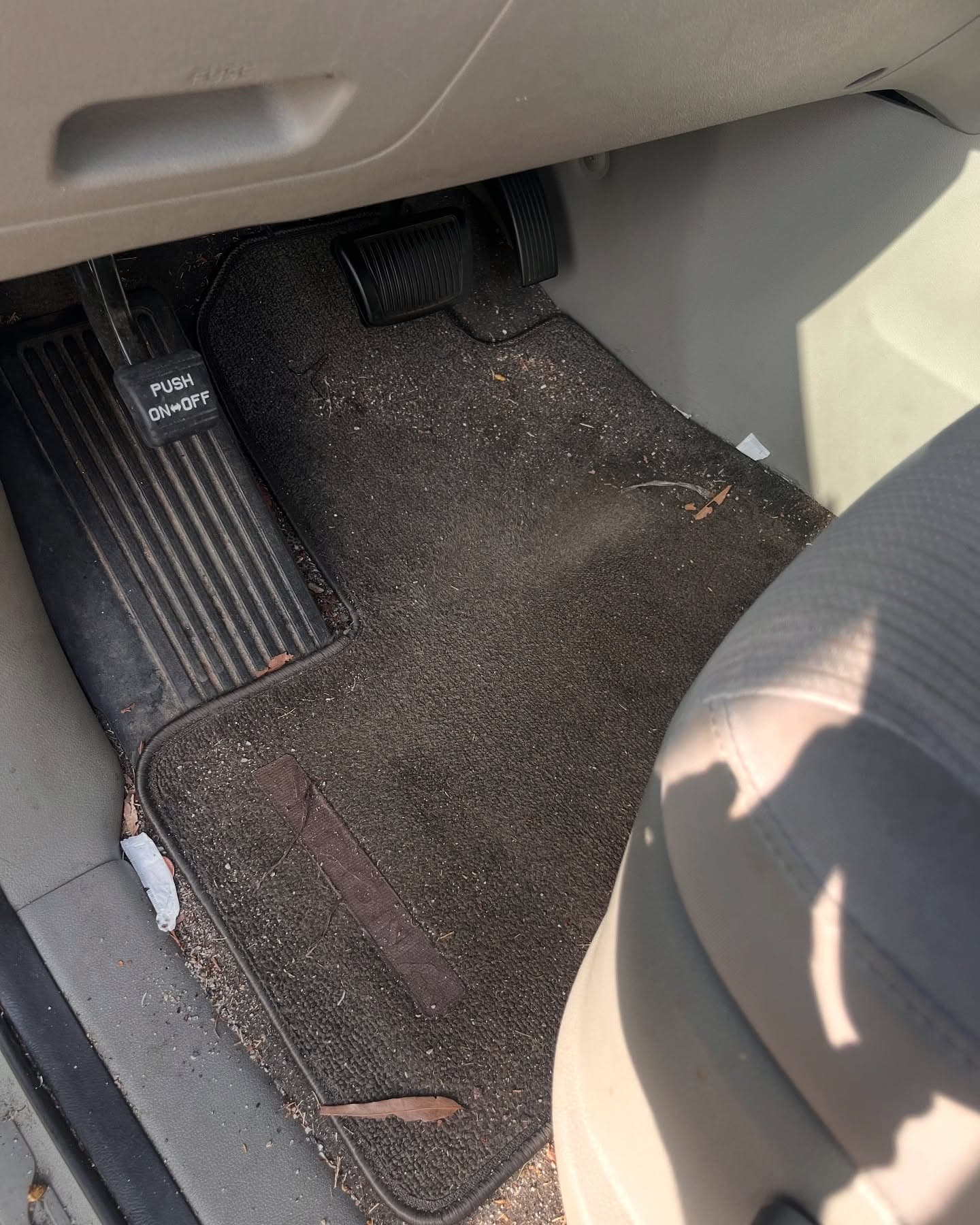 Before interior detail — dirt and debris on the rear floor mat of a vehicle, Cumming GA