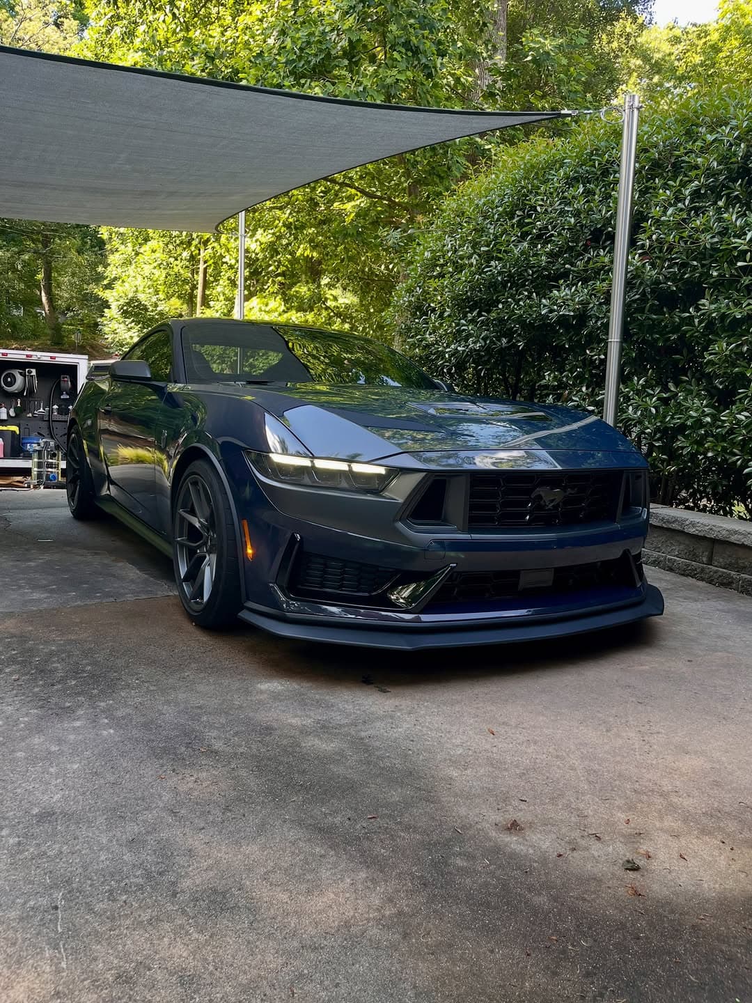Machine paint correction in progress on a Mustang hood, Cumming GA
