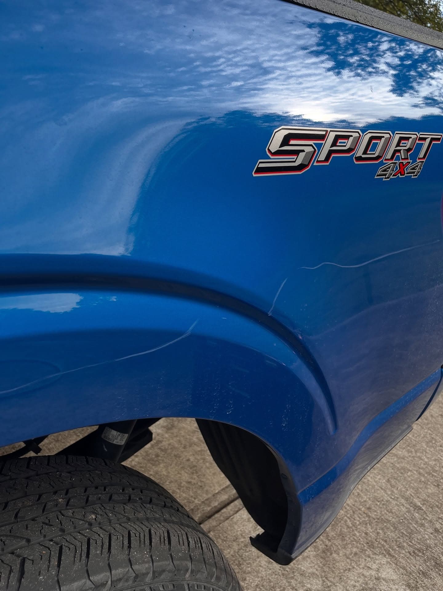 Truck exterior paint before a maintenance detail visit — scratches and dull finish, Cumming GA